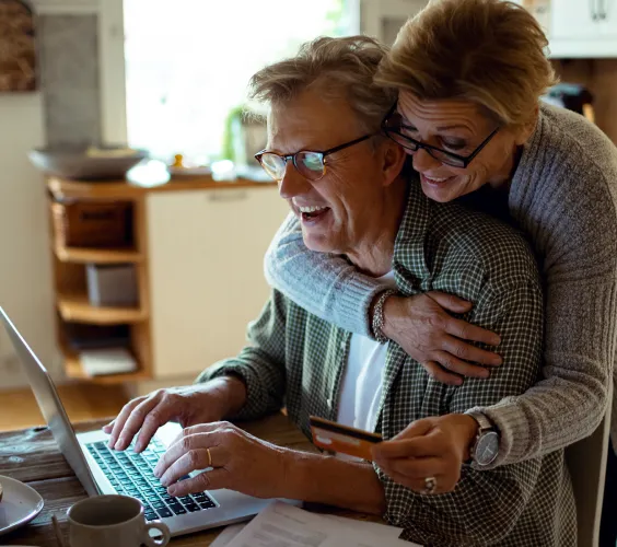 Woman uploading photo on laptop